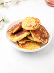 stacks of Corn Fritters with Pancake mix in a white bowl