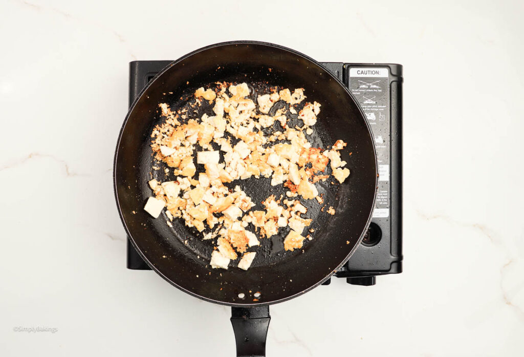 Diced tofu and oil added into the pan