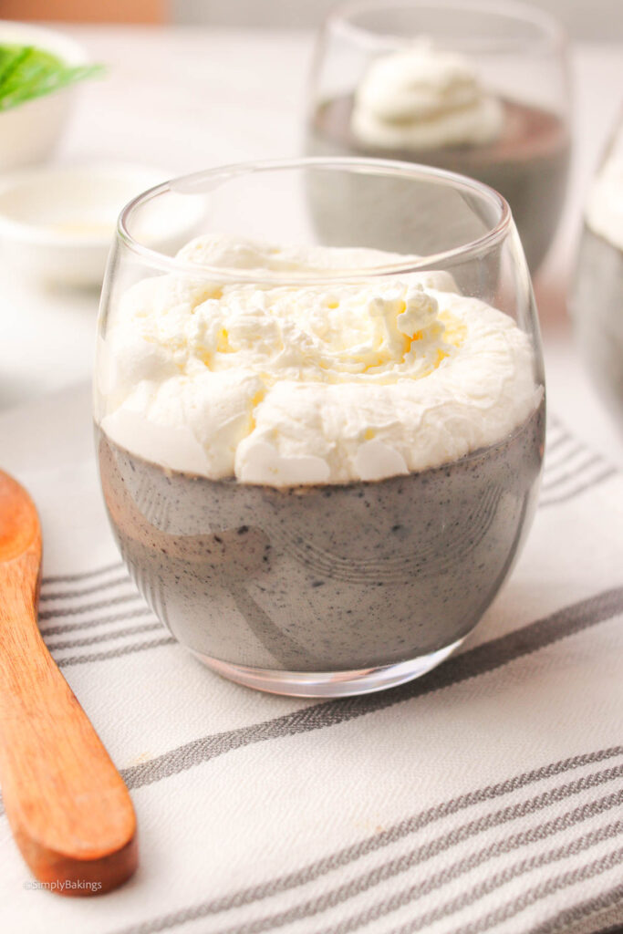 Black Sesame Pudding chilled from fridge and topped with whipped cream