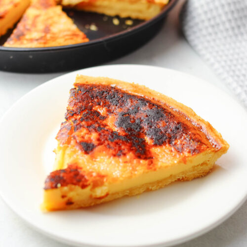 a slice of Filipino Egg Pie served on a white plate