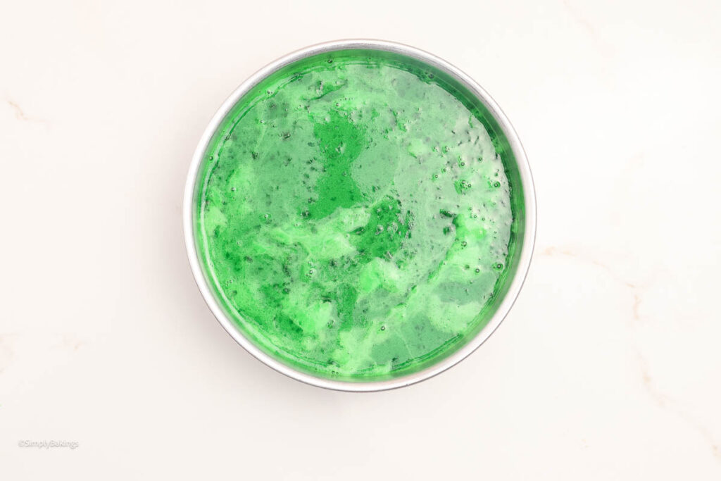 Pandan mixture poured into the cake pan