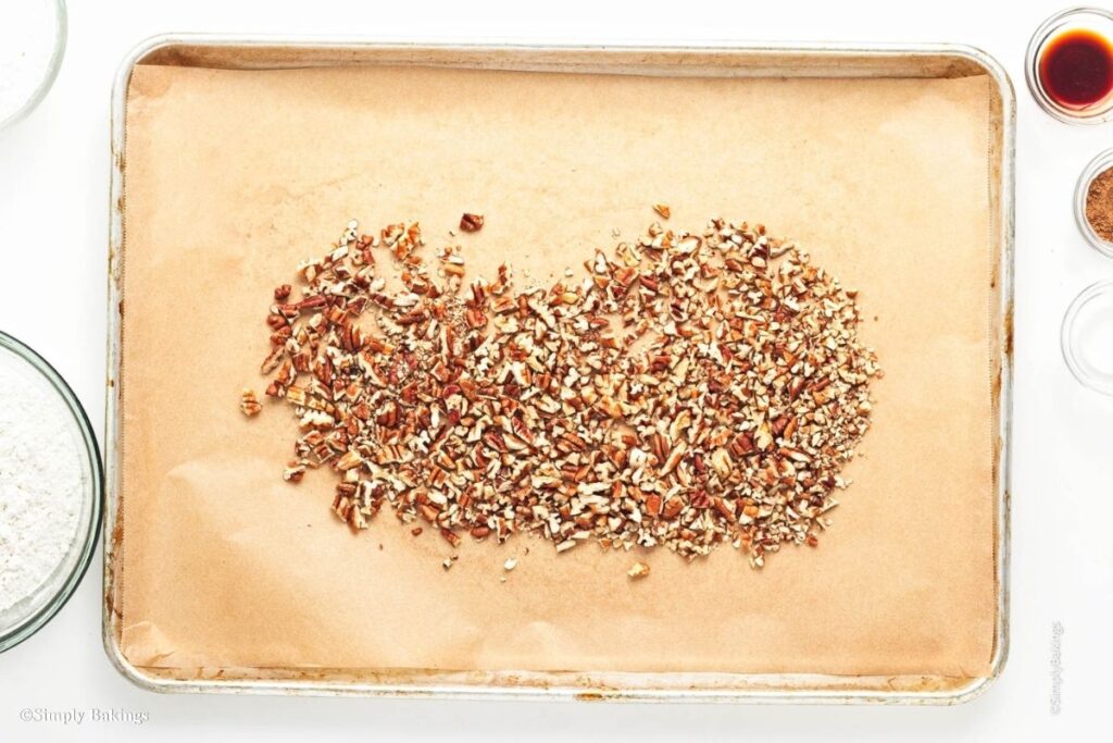 Pieces of pecans on a chopping board