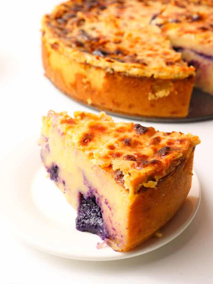 A slice of Ube Cassava Cake on a small white plate
