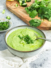 Cucumber Gazpacho served in a bowl with a spoon in it