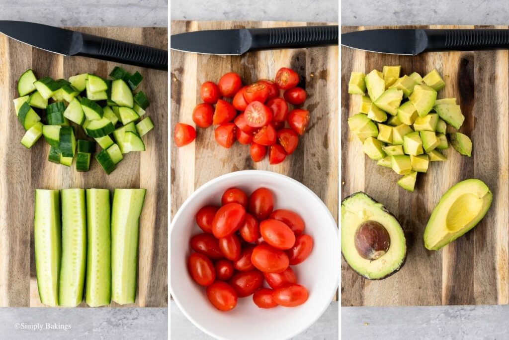 Chopping board with cucumber, tomatoes and avocados