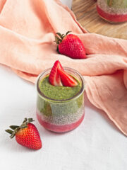 a cup of Strawberry Matcha Pudding topped with strawberry slices