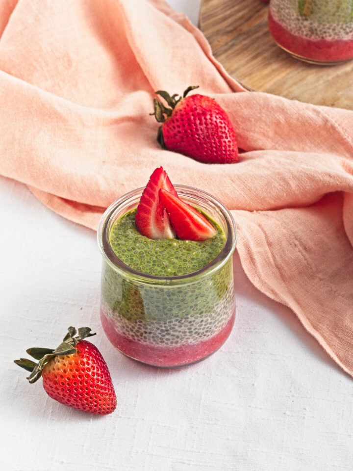 Strawberry Matcha Pudding surrounded with berries