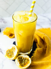 Passion Fruit Juice in a tall glass glowing yellow