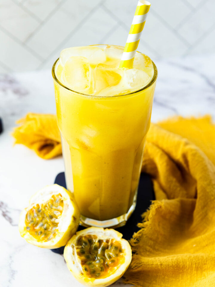 Passion Fruit Juice in a tall glass glowing yellow