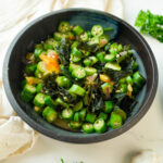 A black bowl with Asian Okra recipe served