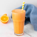 A tall glass of Ginger Orange Juice served