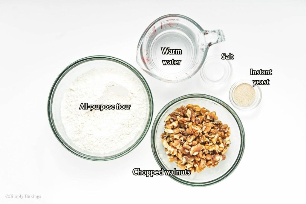 All ingredients for Crusty Walnut Rolls in separate bowls