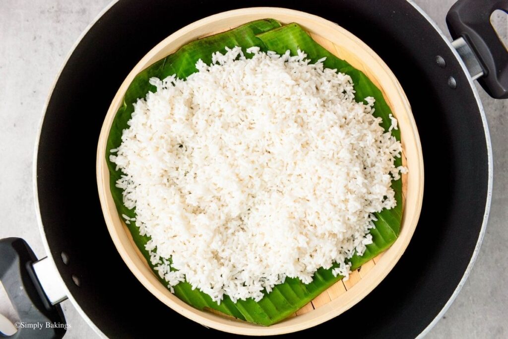 Steamed rice in bamboo steamer