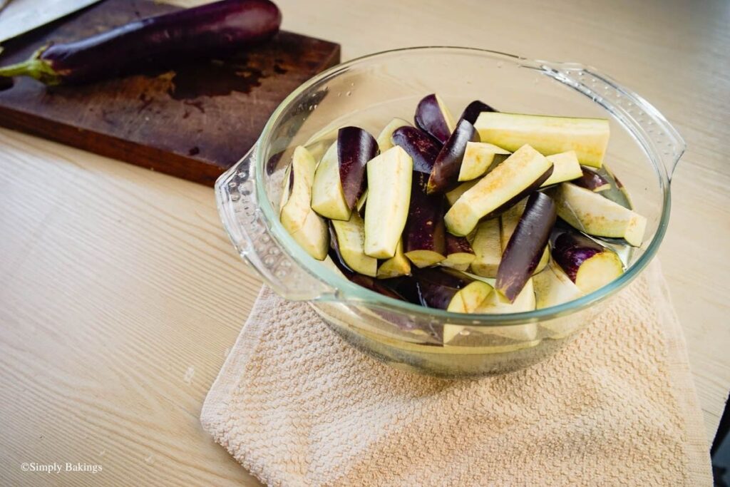Slices of eggplant in a white bowl