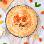 freshly baked focaccia topped with tomatoes and onions