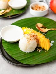 Filipino Mango Sticky Rice served a banana leaf with a spoon