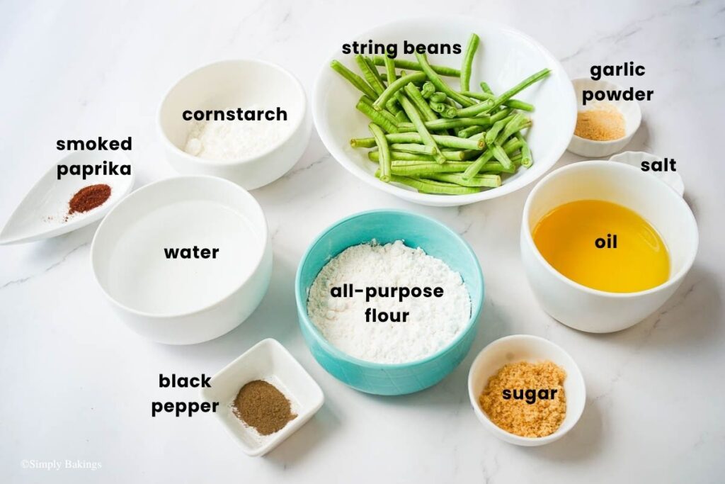 All ingredients for deep fried string beans in bowls