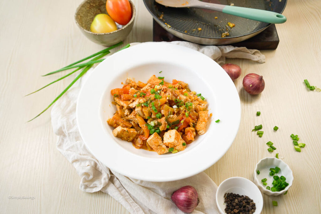 Kinamatisang Tofu in a white bowl