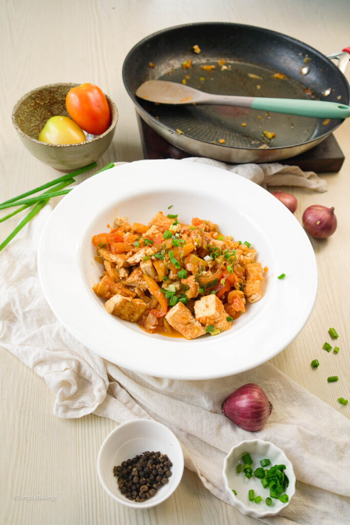 A bowl of savory kinamatisang tofu and ingredients