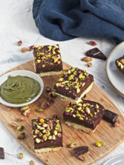 Pistachio Chocolate Bars served on a wooden board