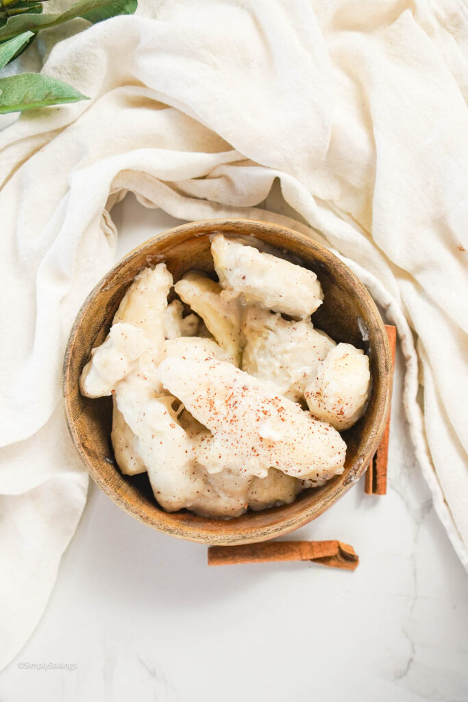 cooked taro served in a wooden bowl, served at the table with a white cloth