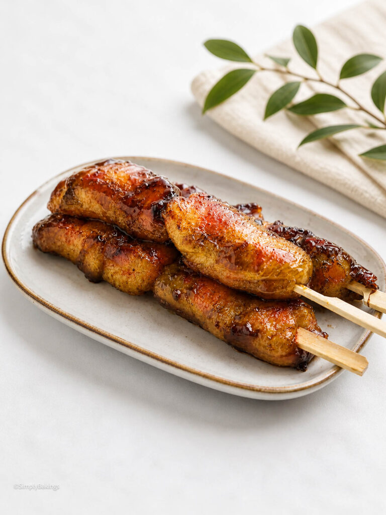 Banana cue in sticks served at the table