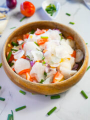 Filipino radish salad served in a wooden bowl