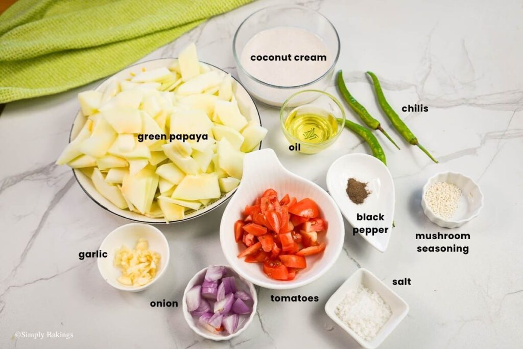 All ingredients for Ginataang Papaya in separate bowls