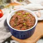 Kamatis bagoong in a small glass