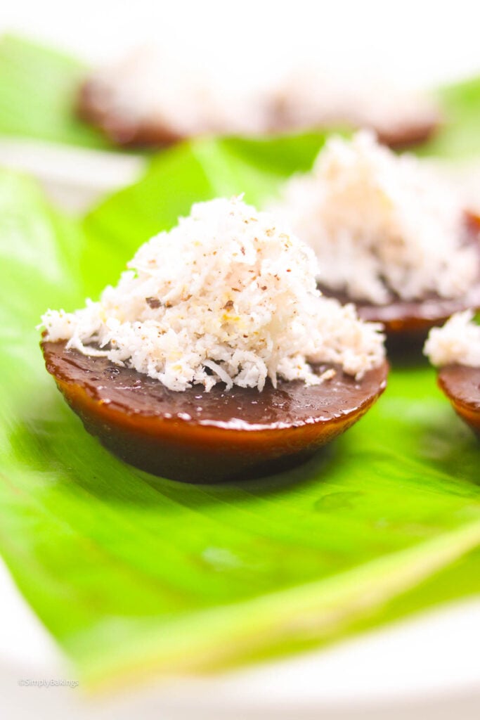 a kutsinta topped with grated coconut served at the table