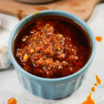 Homemade chili garlic sauce at the table