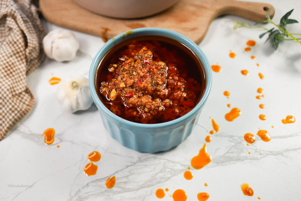 Chili garlic sauce in a blue cup