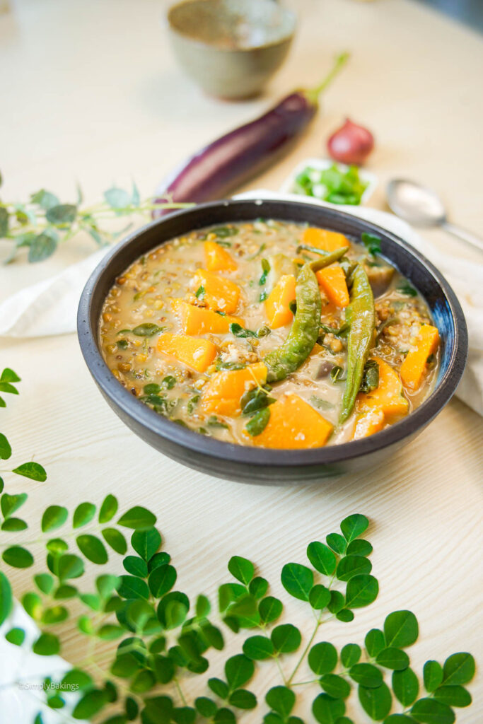 Monggo with kalabasa dish served in a black bowl