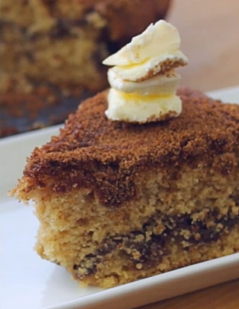 Coffee cake slice on a white plate