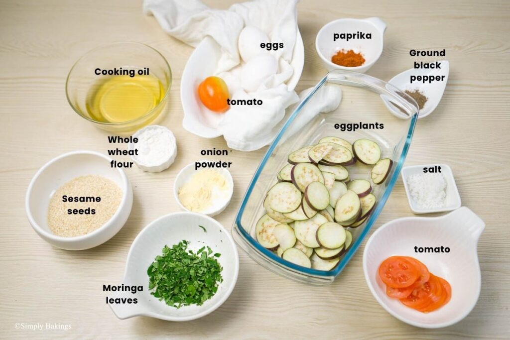 All ingredients of eggplant omelette in bowls